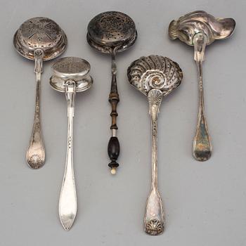 Four Swedish 19th-/20th century parcel-gilt caster-spoons and a sauce-spoon.