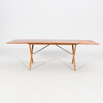 A Hans J Wegner "Savbukkebordet AT-303", teak and oak drop-leaf dining table, Andreas Tuck, Denmark 1950s-1960s.