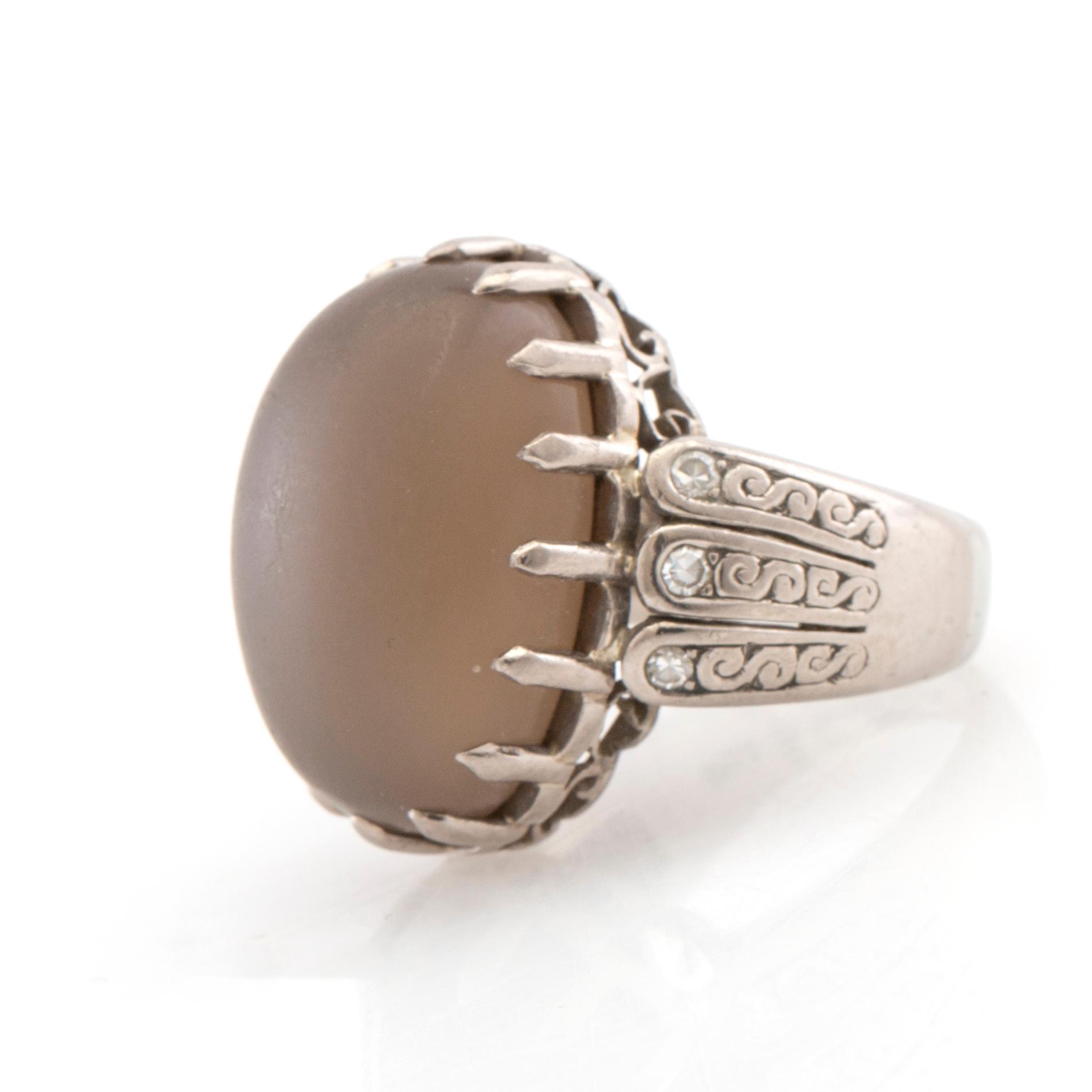 Ring 18K white gold with diamonds and cabochon-cut grey moonstone, Gunnar Fahlström Stockholm 1953.
