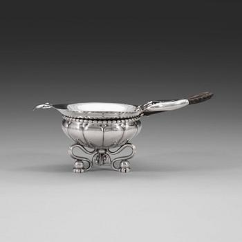 566. A Georg Jensen tea-strainer with stand, Copenhagen ca 1915-21.