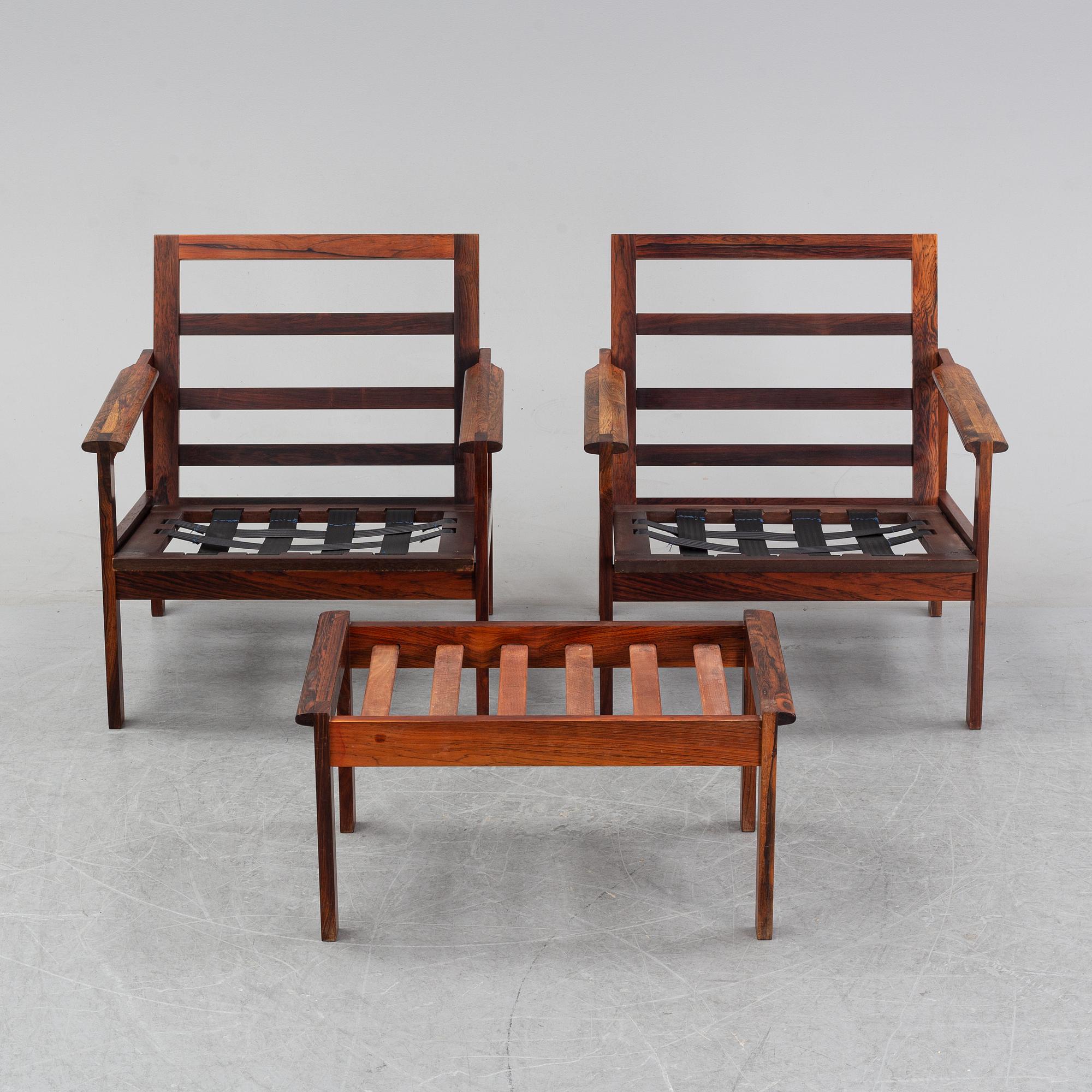 Illum Wikkelsö, a pair of 'Capella' easy chairs and one stool. Eilersen, Denmark. Designed 1959.
