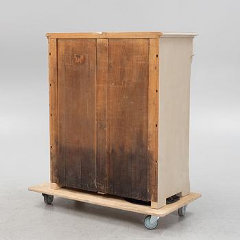 A painted cabinet from around the year 1900.