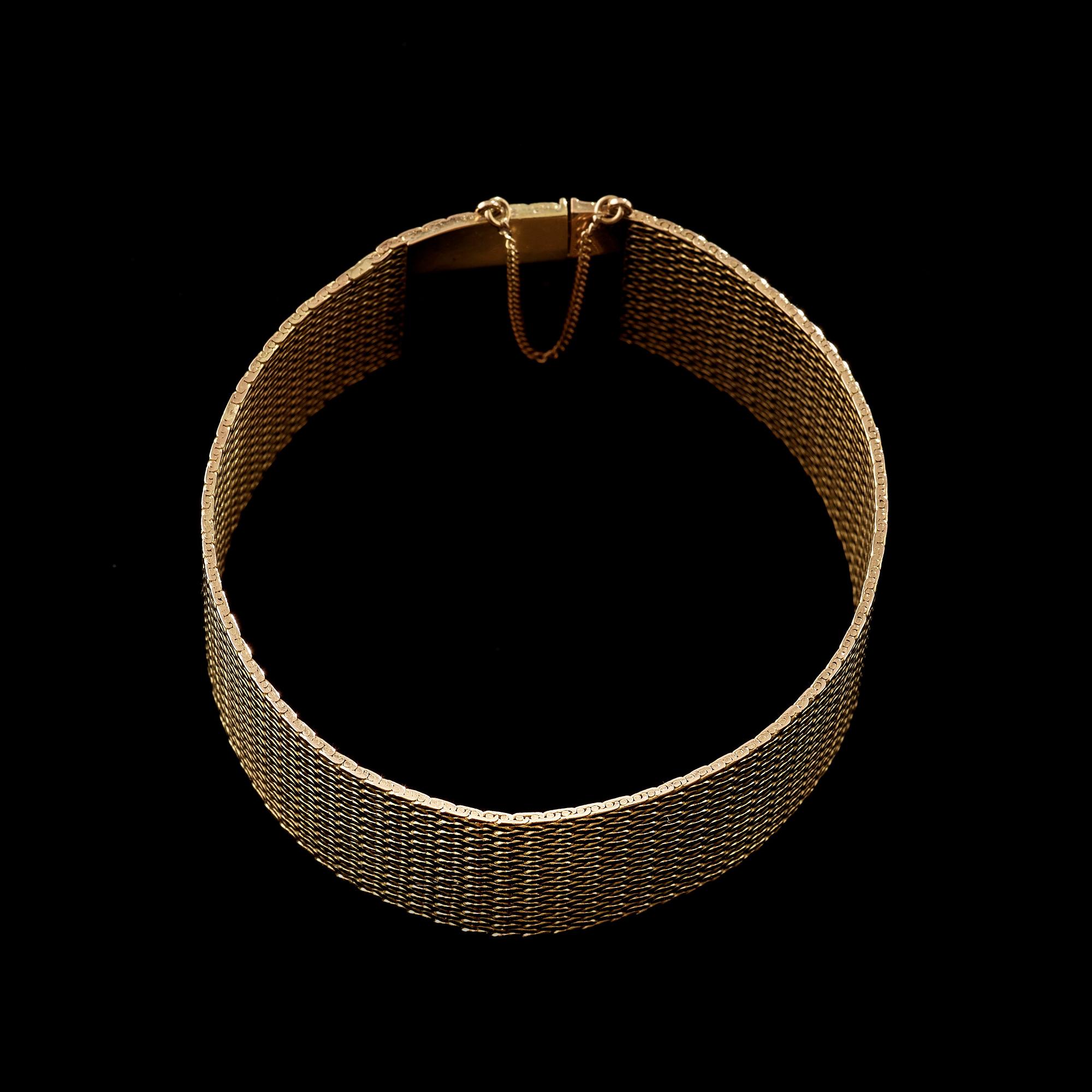 A gold bracelet.