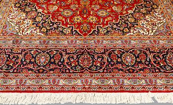 A carpet, Keshan, signed, c. 488 x 294 cm.