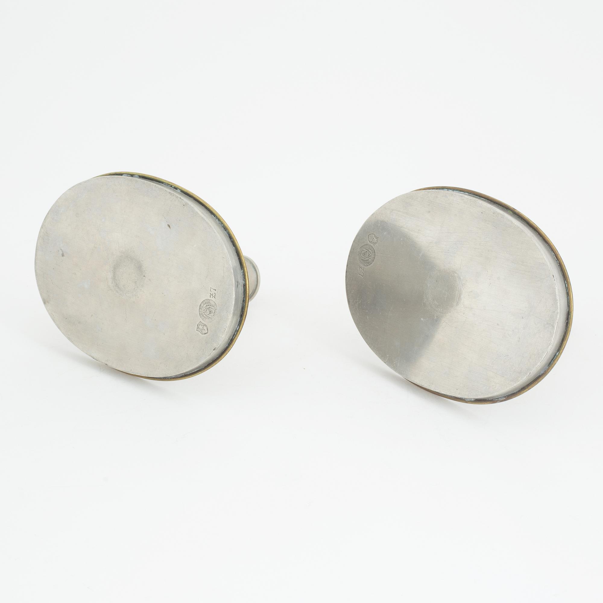 Nils Fougstedt, probably, a pair of pewter and brass candlesticks, model '93', for Firma Svenskt Tenn, Stockholm 1926.