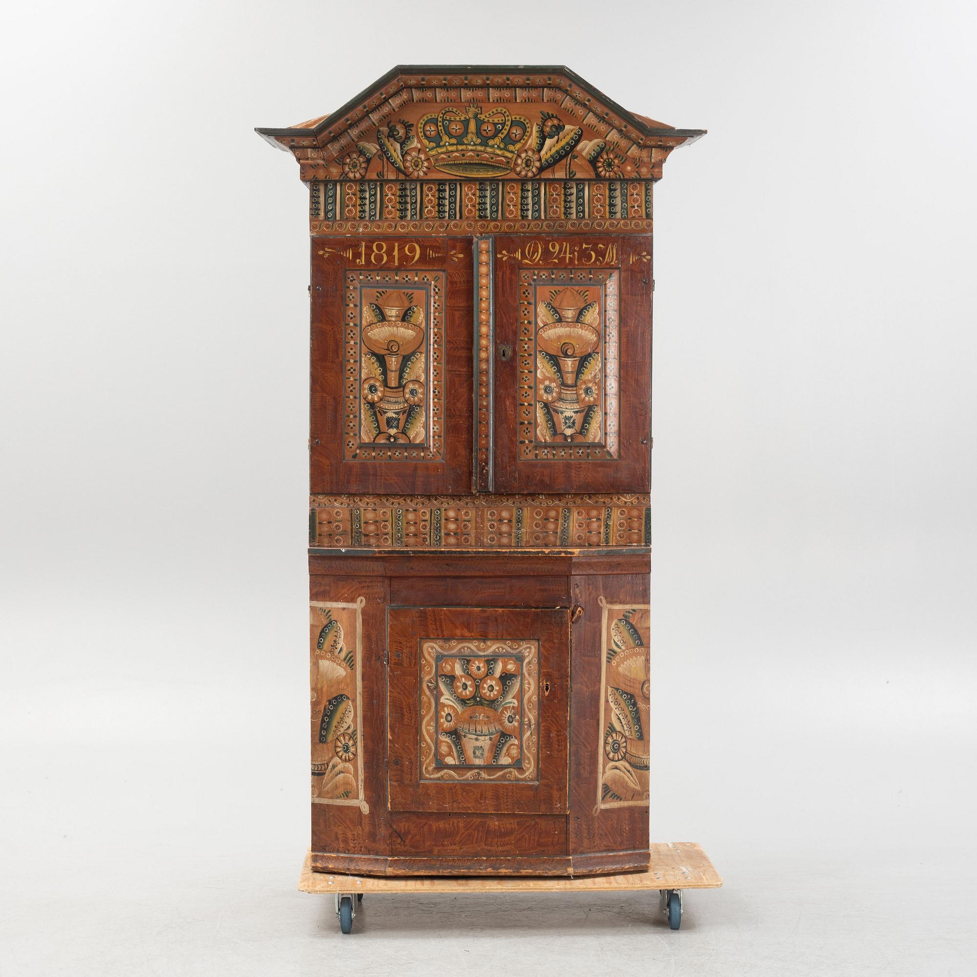 A Swedish traditional painted cabinet, dated 1819.