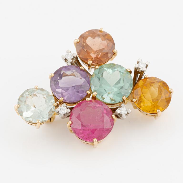 Brooch in 18K gold with faceted coloured stones, including tourmalines and round brilliant-cut diamonds.