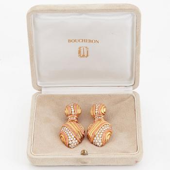 A pair of 18K gold Boucheron earrings set with round brilliant-cut diamonds and coral.