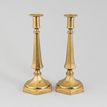 A PAIR OF 19TH CENTURY BRONZE CANDLESTICKS.