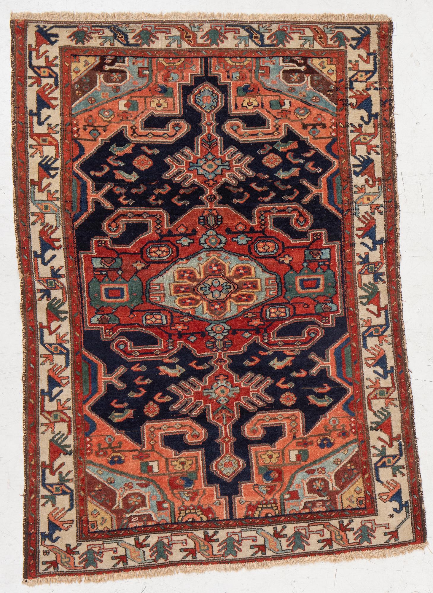 A Heriz rug, c. 192 x 133-139 cm.