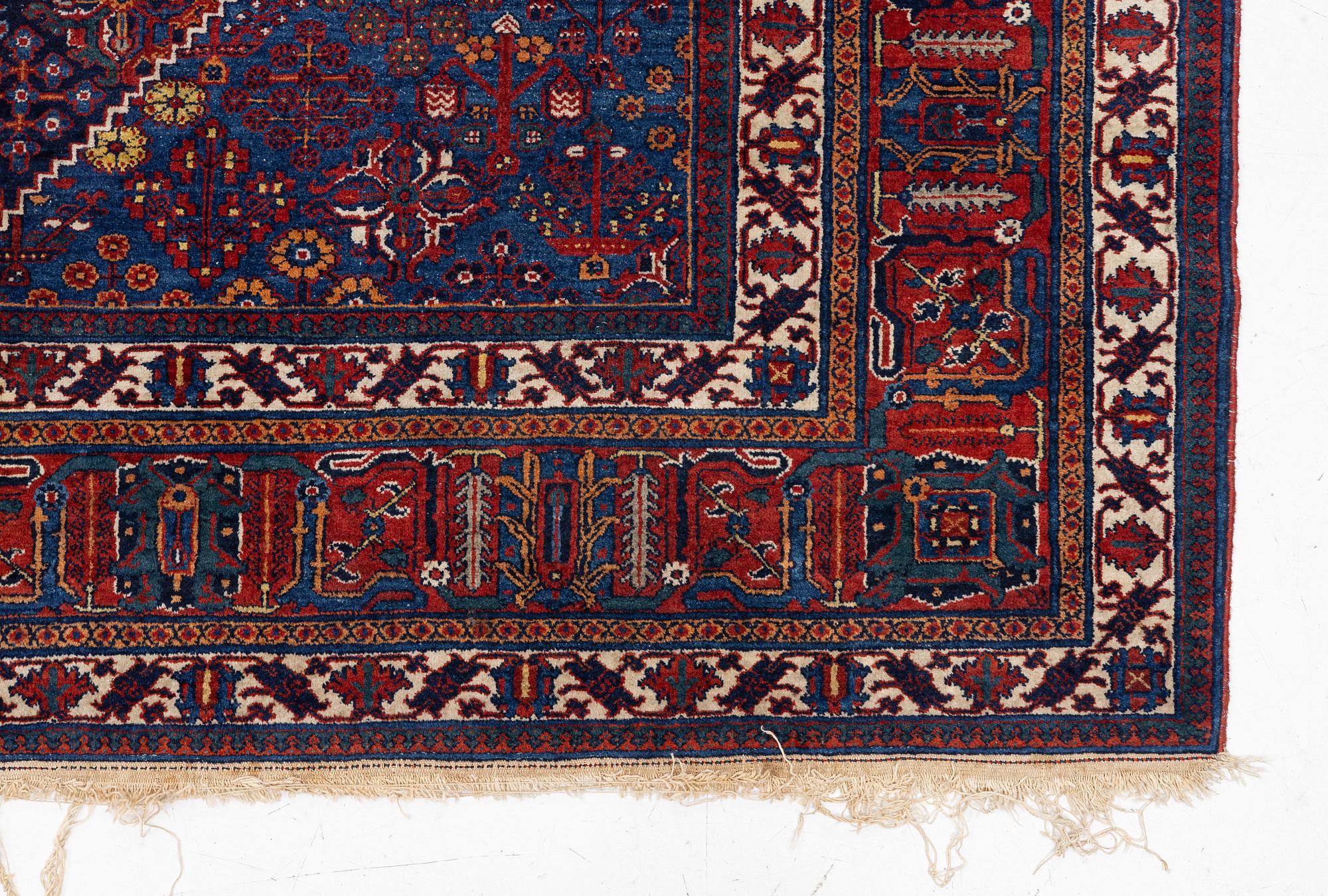 An oriental carpet, c. 360 x 270 cm.