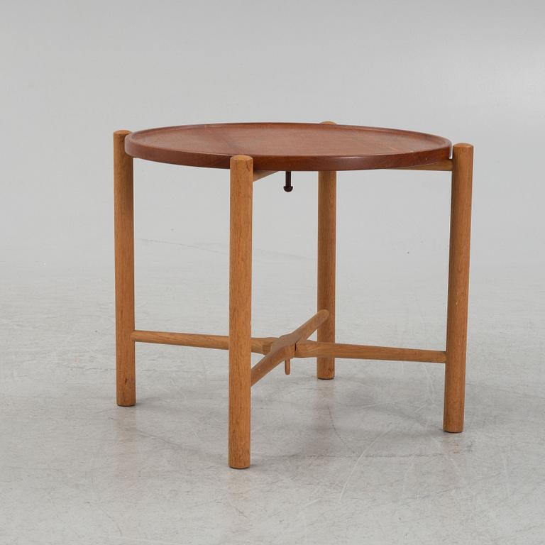 Hans J. Wegner, a model PP35 teak and oak tray table, Andreas Tuck, Denmark, mid 20th Century.