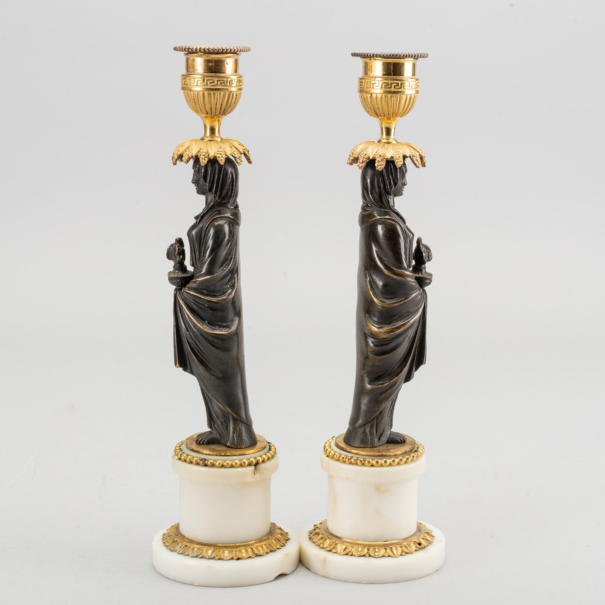 A pair of Louis XVI 18/19 century candlesticks.