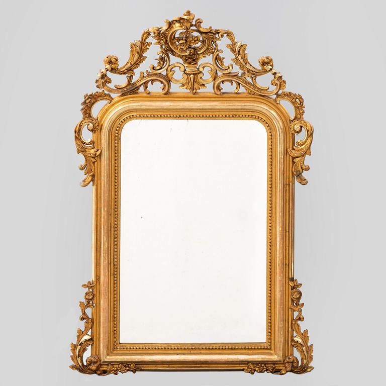 A giltwood Rococo revival mirror, second half of the 20th Century.
