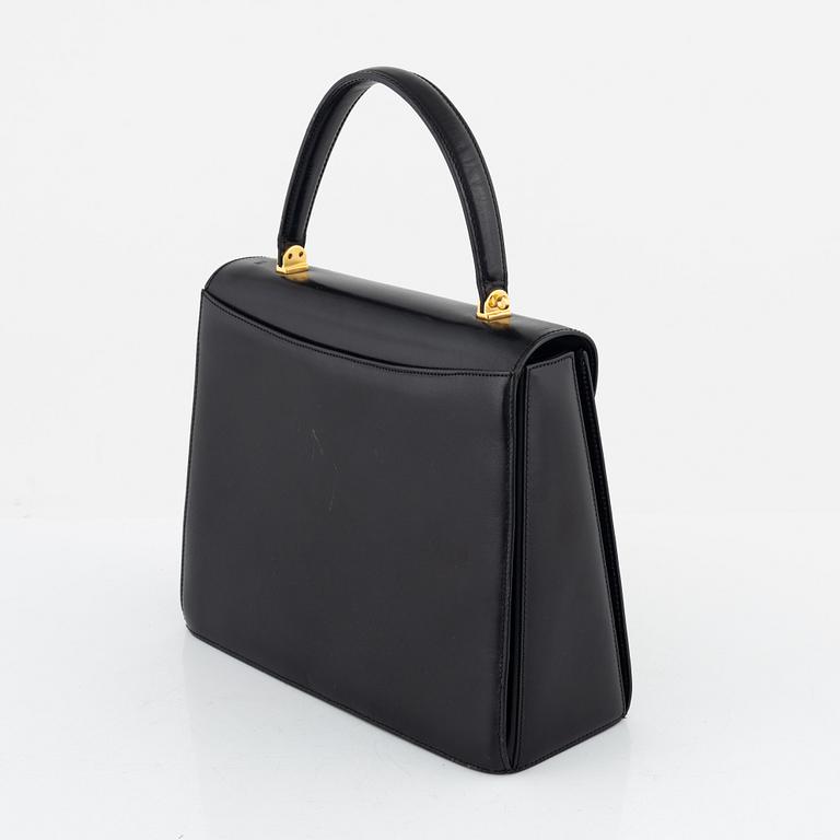 Bally, a black leather bag.