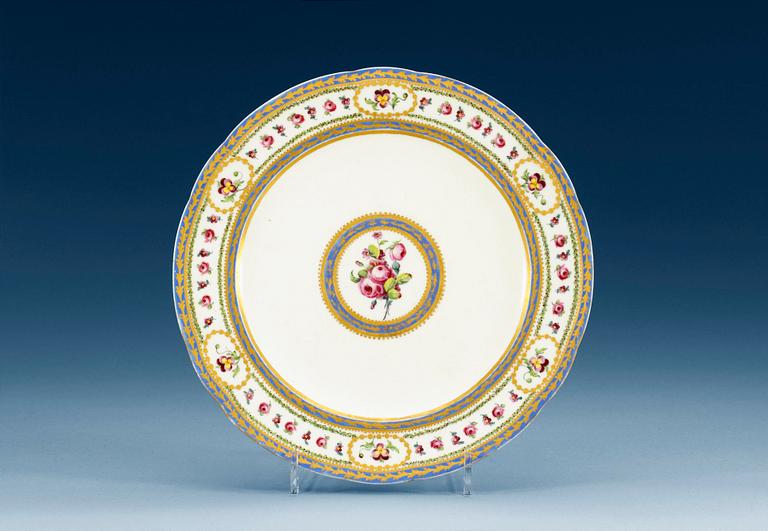 A Sèvres lobed plate, 18th century, with painter´s mark Madame Taillandier. Gilders mark for E-G Girard.
