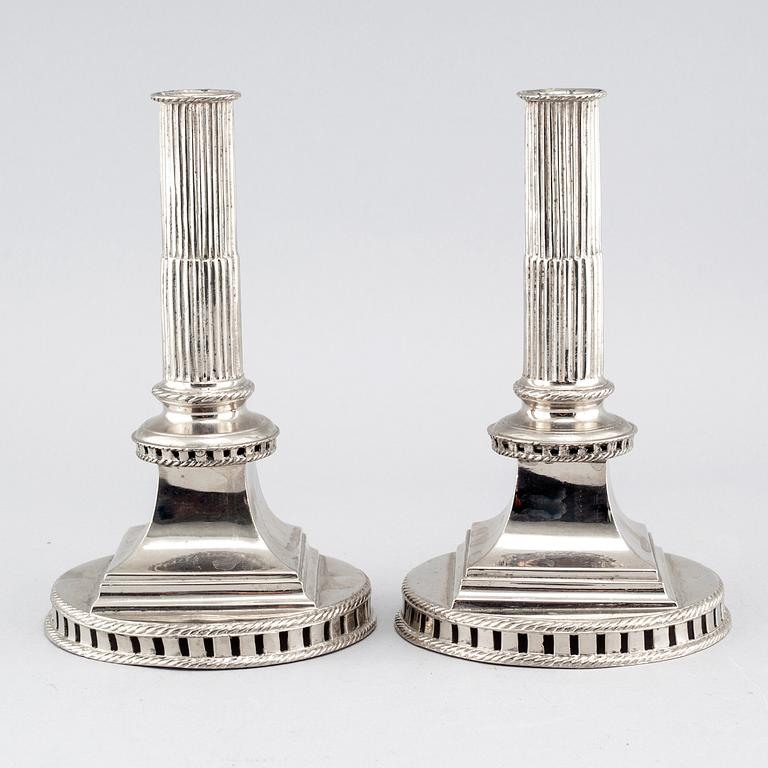 A pair of candlesticks in silver-plated pewter, by Gottlob Friedrich Baumann in Hudiksvall, 1794 and 1799.