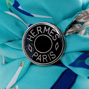 HERMÈS, two silk braclets with palladiumcovered locks.