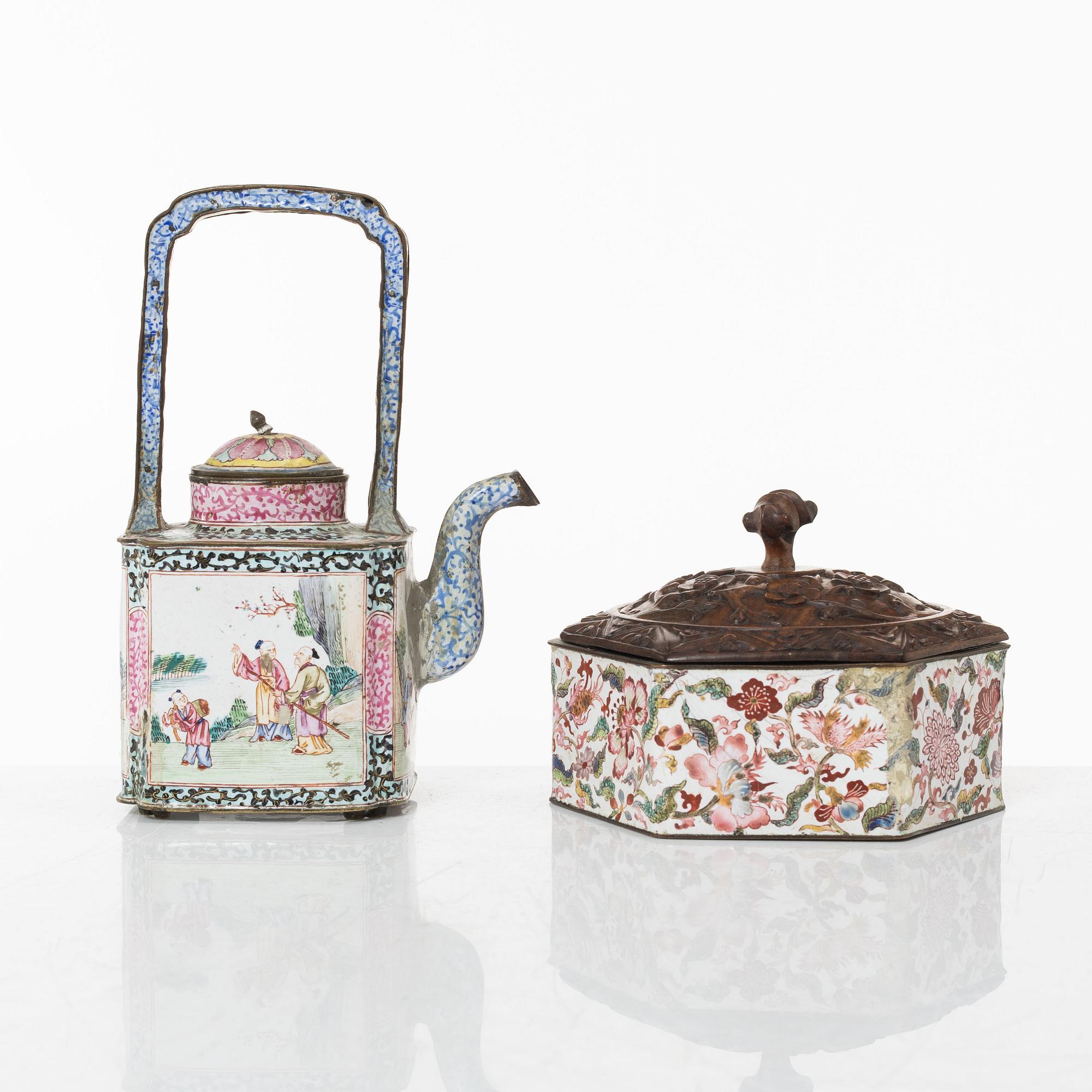 A Chinese enamel on copper teapot and an enamel box with carved wooden cover, Qing dynasty, 18th century.