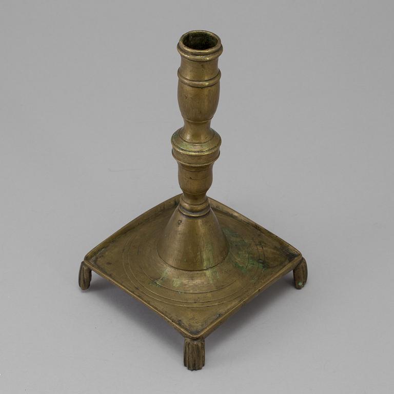 A 17th century bronze candlestick.