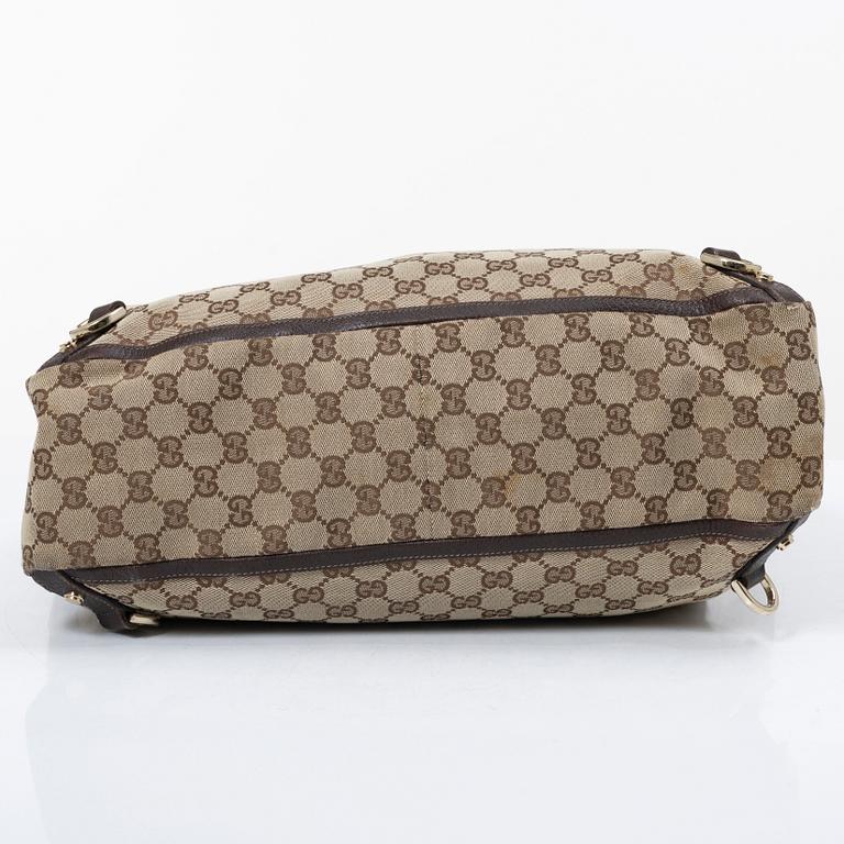 Gucci, a canvas and leather bag.