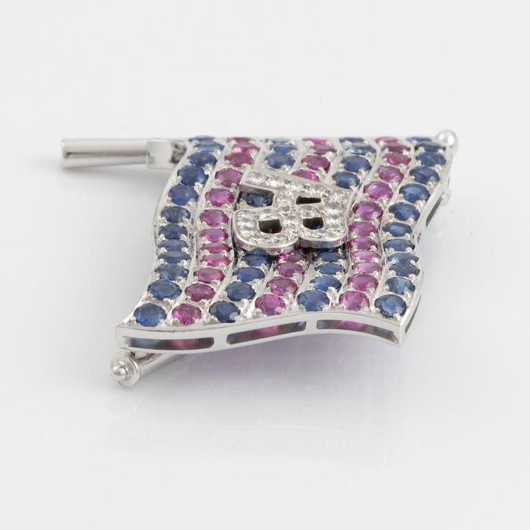 A brooch with Broströms flag in 18K white gold with monogram.