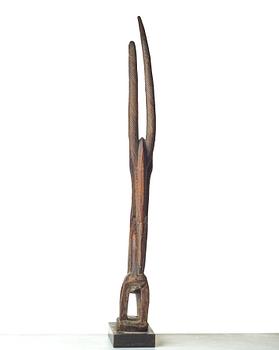A SCULPTURE, a headdress, Tshiwara/Ciwara (stylized male antelope), wood, the Bambara tribe, Mali, h. 94 cm. On a base.