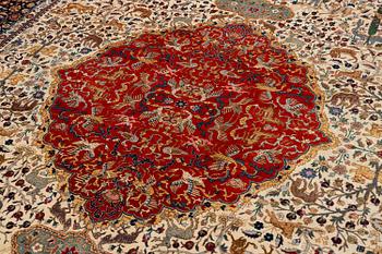 A semi-antique Benlian Tabriz carpet of 'Coronation' design, signed Jabarzade, c. 488 x 367 cm.