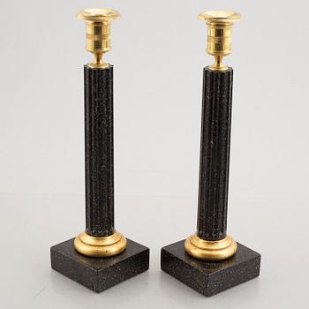 A pair of porphyry imitation candlesticks, 20th century.