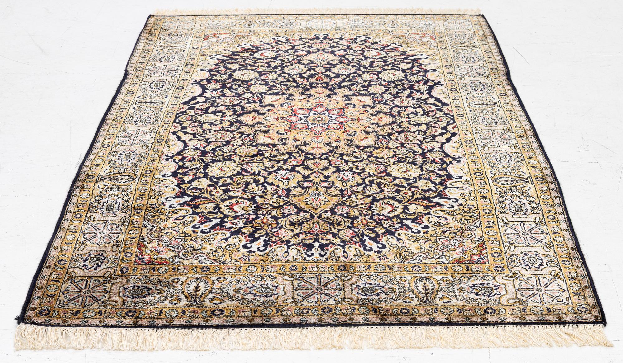 A Ghom, silk rug, c. 162 x 102 cm.