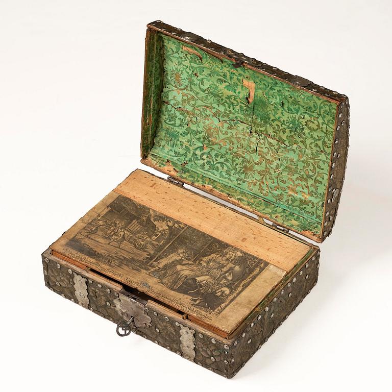 A presumably German baroque repoussé brass writing box, late 17th century.
