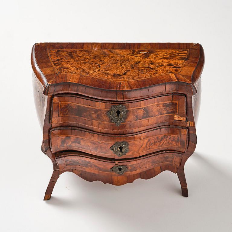 A Swedish rococo walnut parquetry miniature commode, later part 18th century.