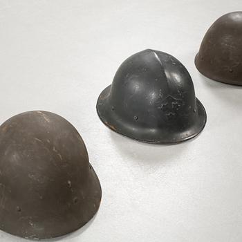 Five military helmets and a hat, late 19th and 20th century.