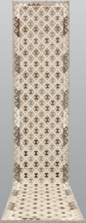 A Kilim runner, c. 394 x 82 cm.