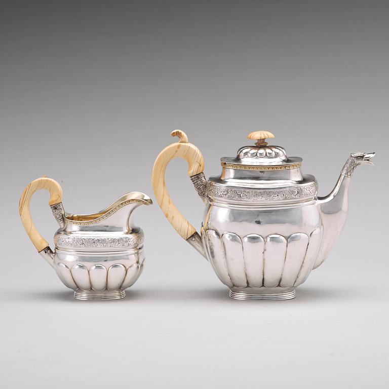 A Russian 19th century parcel-gilt silver coffeepot and cream jug, mark of Gustav Lindgren, St Petersburg 1827.