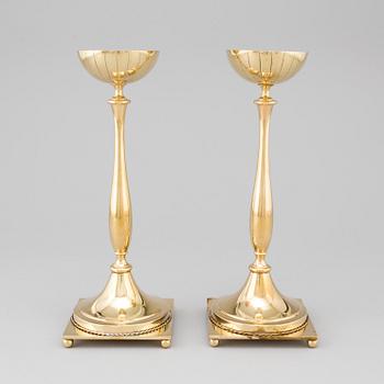 A pair of mid 20th century brass candlesticks by Gunnar Ander for Ystad Metall.