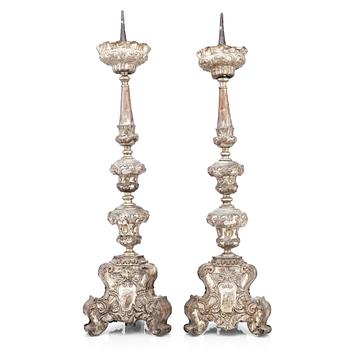 103. A pair of argente haché Baroque floor candlesticks, presumably Italy 18th century.