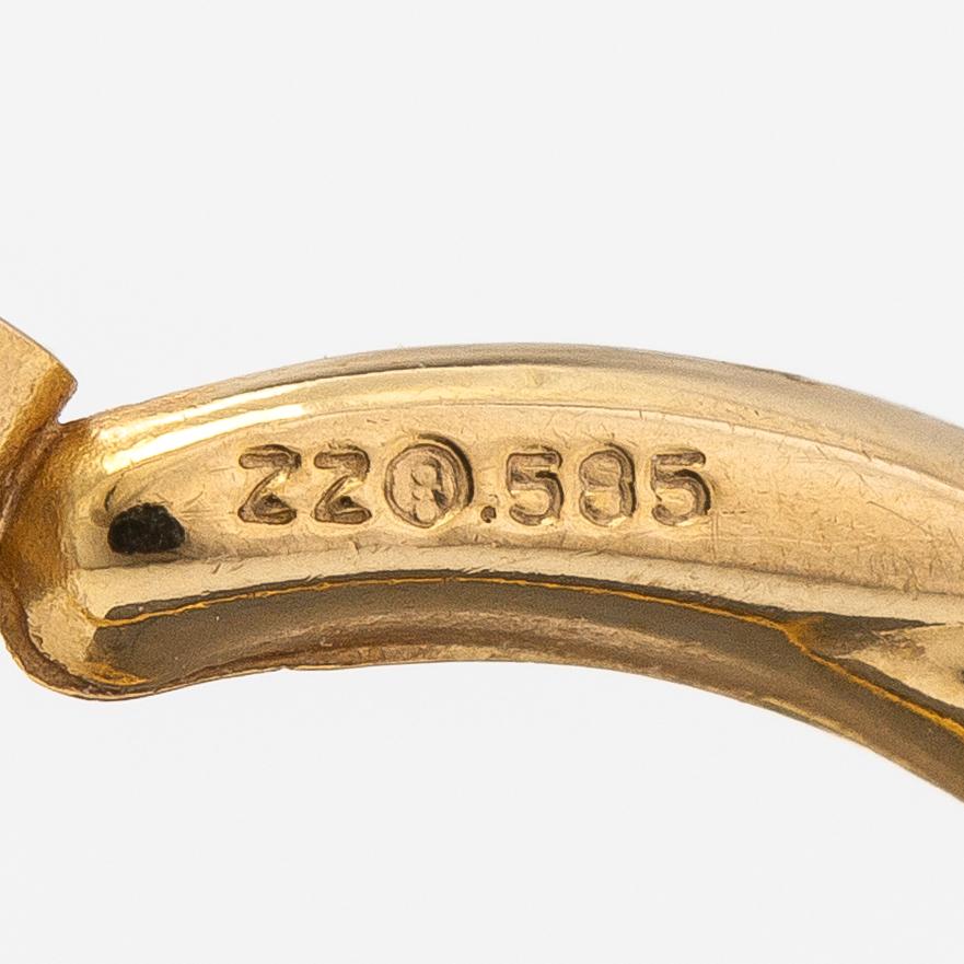 A pair of 14K gold earrings.