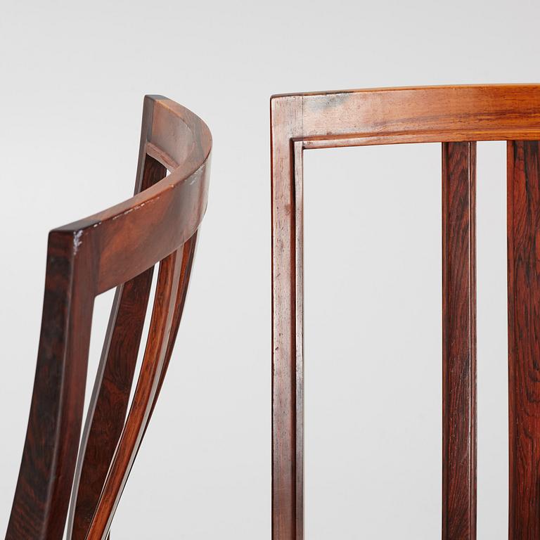 Bertil Fridhagen, a rosewood-veneered dining table with four chairs, BOdsfors, Sweden, 1960's.