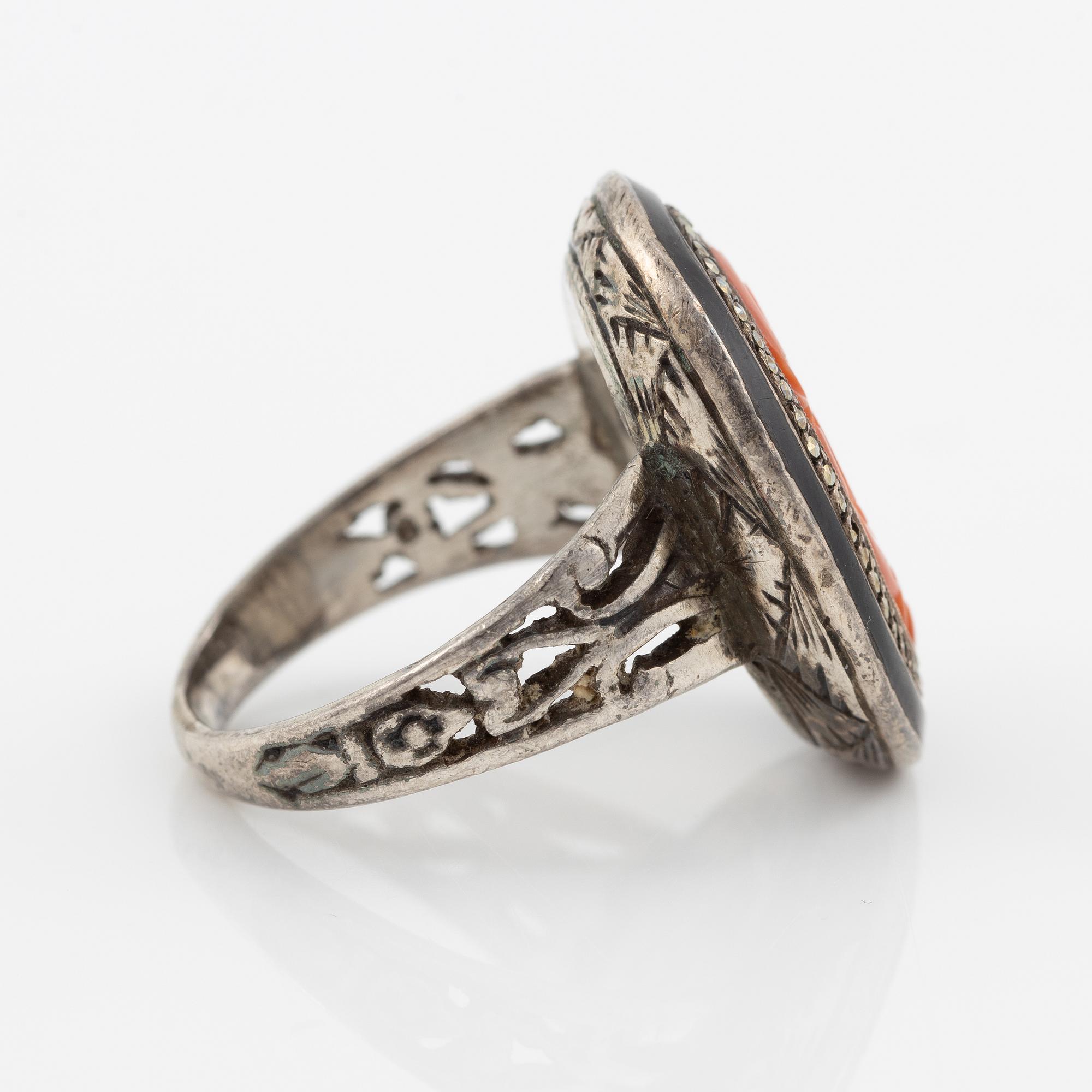 Silver ring with coral and marcasites and with black details.