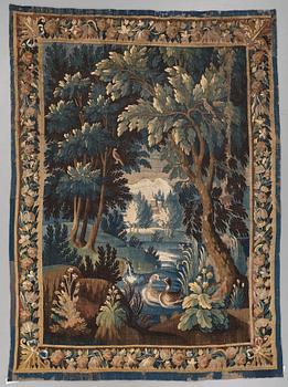 257. A TAPESTRY, tapestry weave, a "Verdure",  ca 304 x 224,5 cm, Flanders 17th century, signed "W" a lily "B".