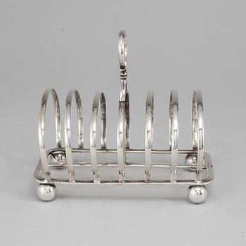 An English 20th century silver-plated toast rack, marked WH.