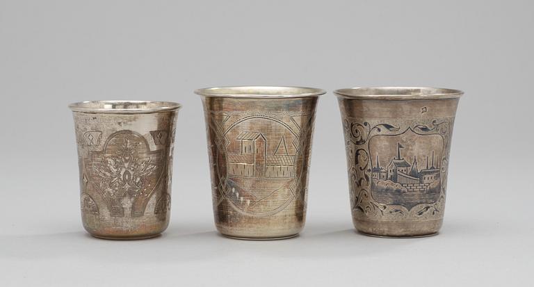 Three parcel-gilt and niello beakers, different makers, Moscow 1863-1895.
