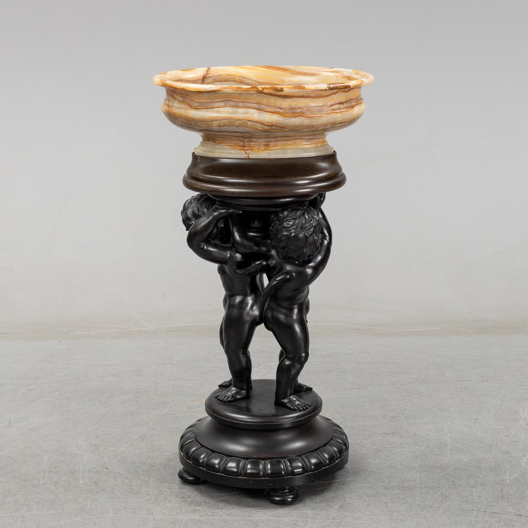 A wooden pedestal with onyx bowl, 20th Century.