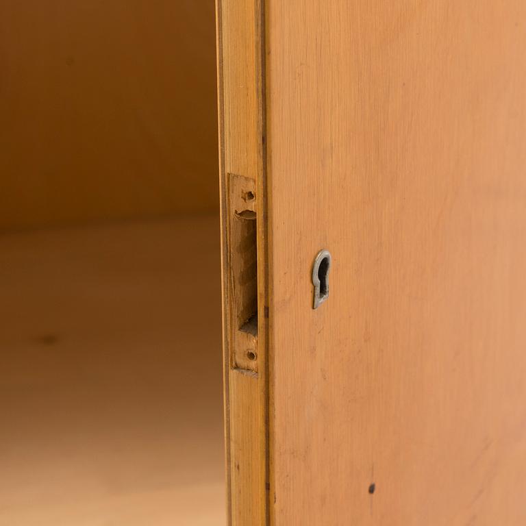 Alvar Aalto, mid-20th century '810' cabinet and a 
'69'chair Oy Huonekalu- ja Rakennustyötehdas Ab.