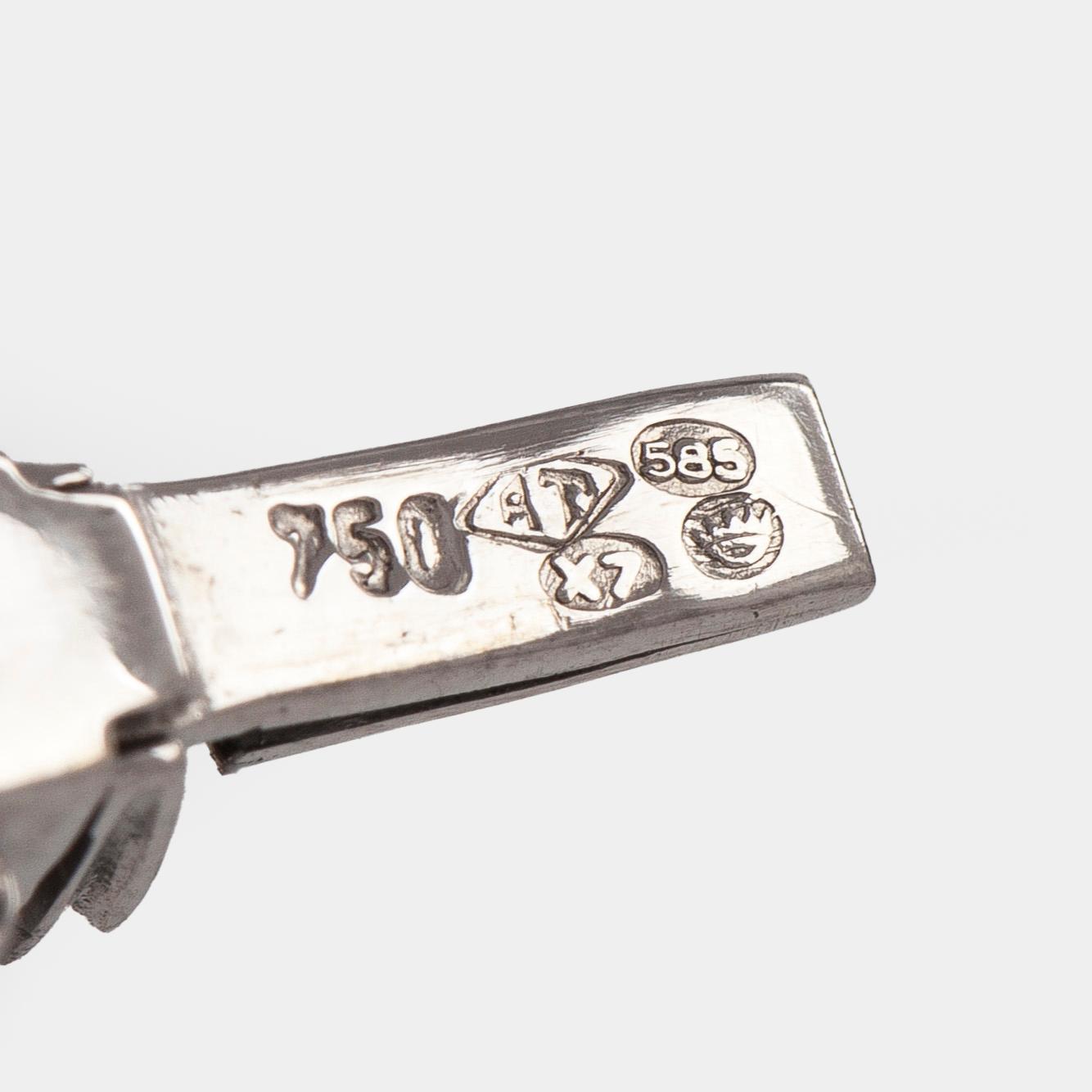 Armband, 14K vitguld med briljantslipade diamanter, Importstämplad A. Tillander 1975.