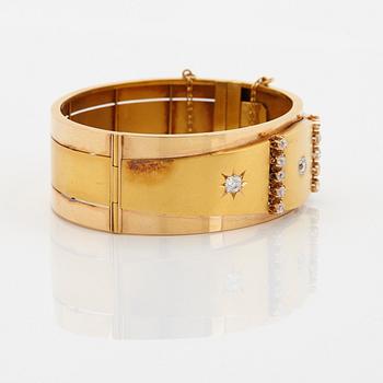 An 18K gold bracelet set with old-cut diamonds.