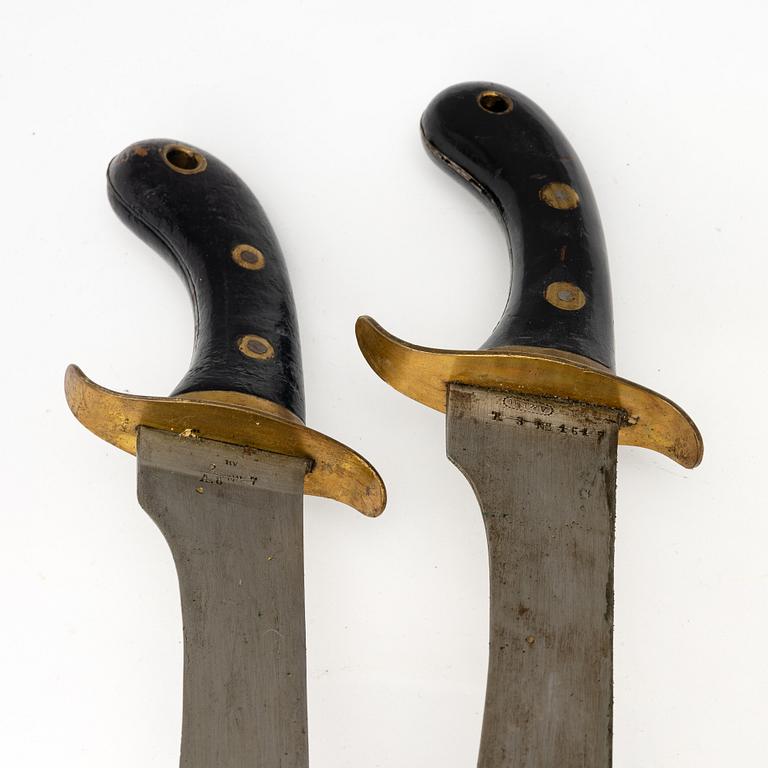 Two Swedish cutlasses 1848 pattern,with scabbards.