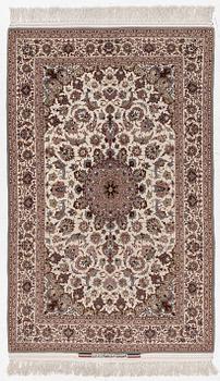 A semi-antique Isfahan rug, central Persia, signed Ghaffarian, c. 180 x 112 cm.