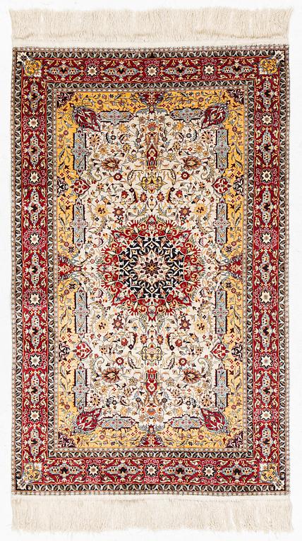 An oriental silk rug, c. 150 x 92 cm.